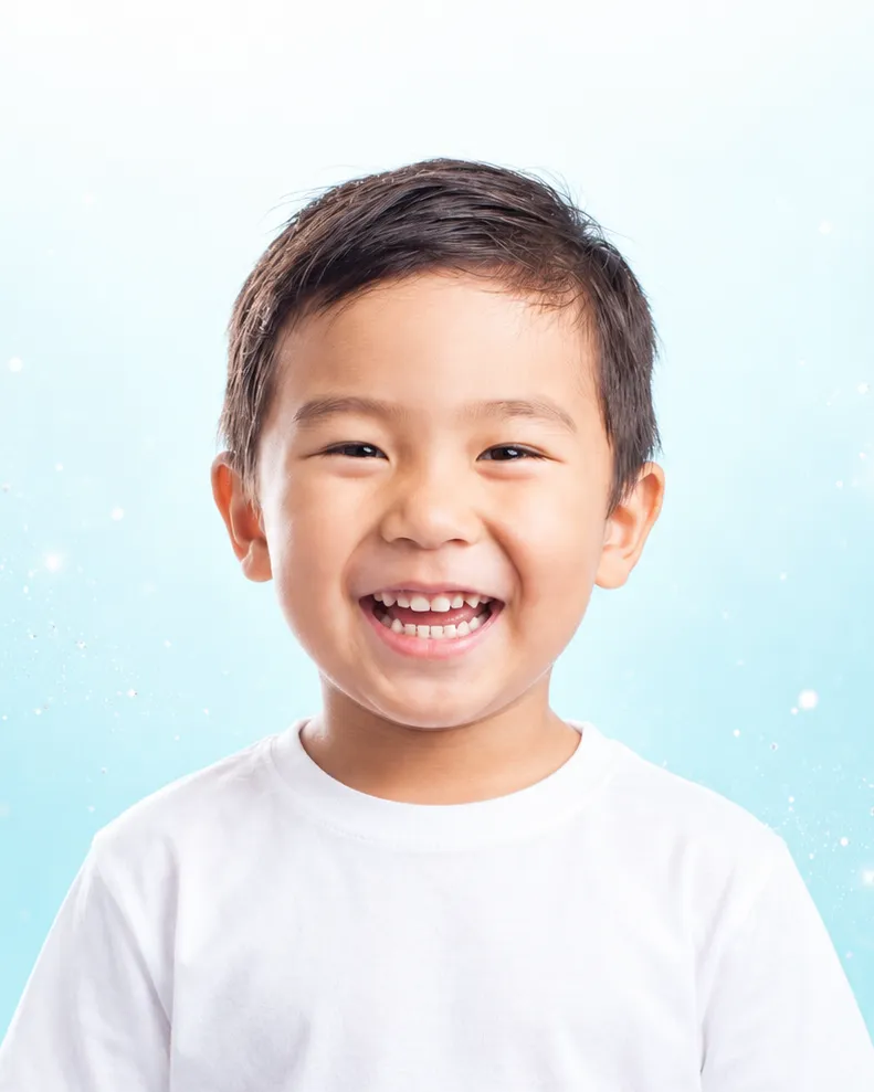 A smiling young boy showing his healthy teeth